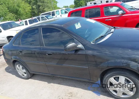 2004 Suzuki Forenza S из США, поврежденный, VIN KL5JD52Z44967910